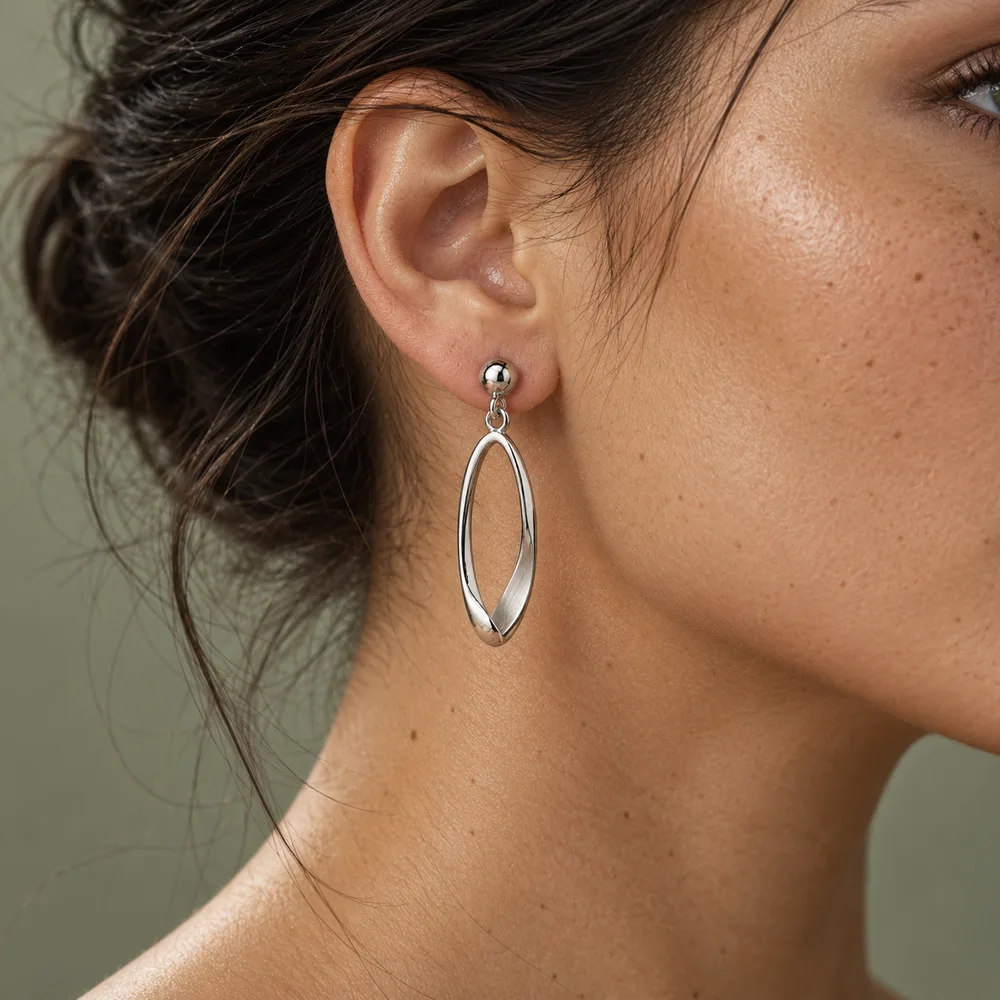 Poise earring worn, in profile